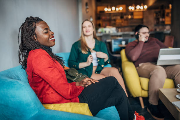 istock Multi-ethnic group of friends sitting in cafe 1179554685