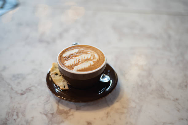 istock Delicious flat white coffee with coffee art on top of marble table 1179554927