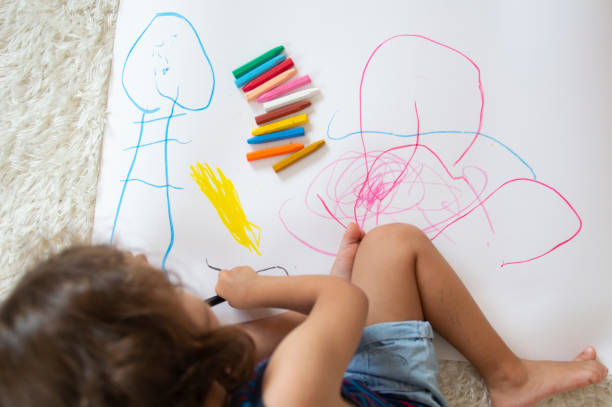 istock Little Girl drawing 1179556065