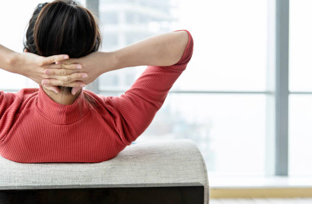 Tired woman resting on sofa