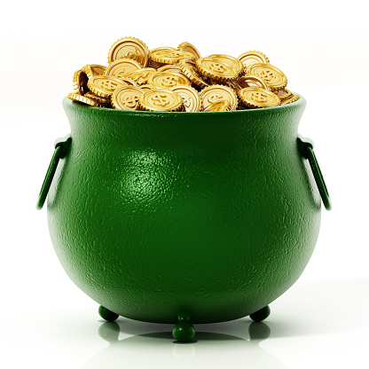 Gold coins inside green cauldron isolated on white.