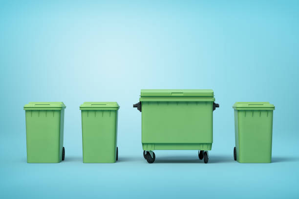 istock 3d rendering of four green trash cans standing in row on light-blue background 1179557499