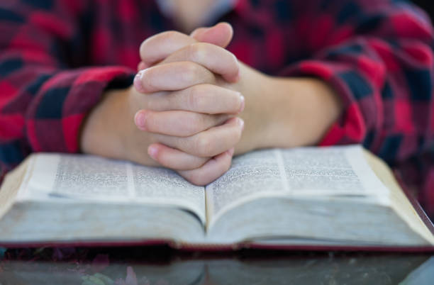 istock Little boy reading the Holy Bible. 1179557826