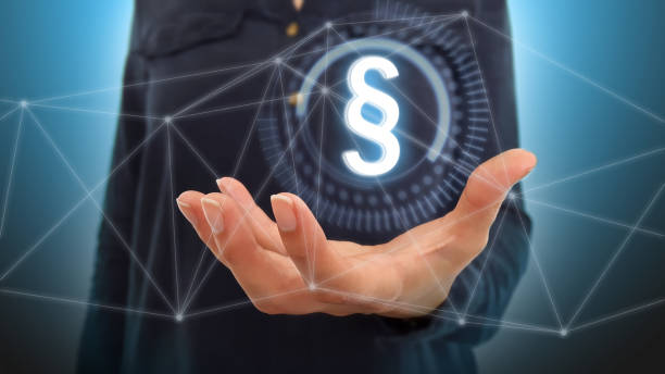 istock Businesswoman on blurred background using digital paragraph law symbol 1179558843