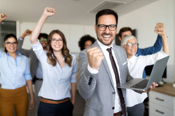 istock Successful company with happy workers in office 1179559245