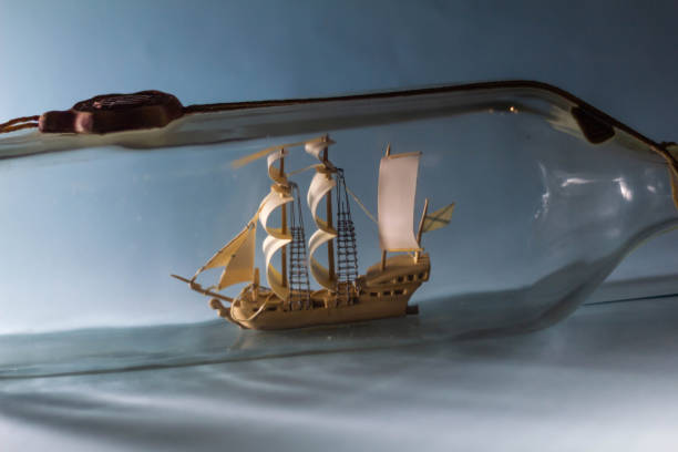 istock Ship in a bottle on a blue background 1179561823