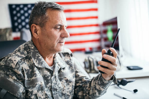 istock Army solider talking on walkie talkie 1179562252