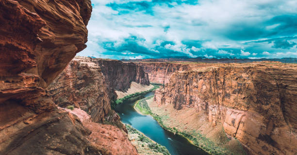 Grand Canyon National Park Dramatic weather at the Grand Canyon National Park where the Colorado River runs through rock formations of eroded sand stone. grand canyon national park stock pictures, royalty-free photos & images