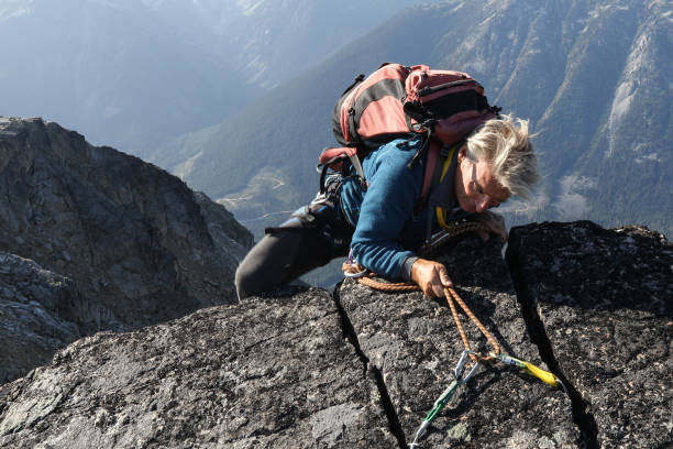 istock Mountaineer rappels himself off cliff 1179562576