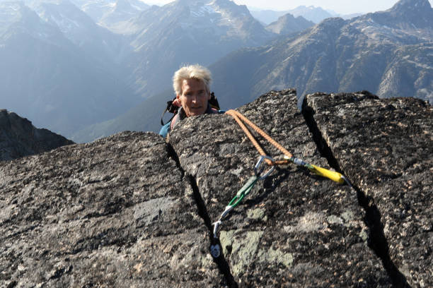istock Mountaineer rappels himself off cliff 1179563385