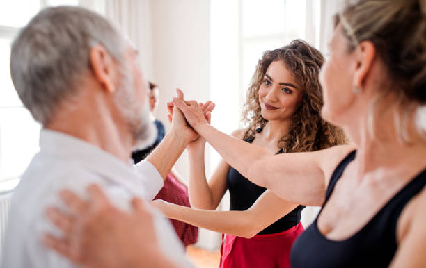 istock Group of senior people in dancing class with dance teacher. 1179563490