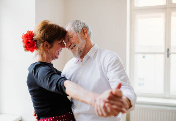 istock Senior couple attending dancing class in community center. 1179563524