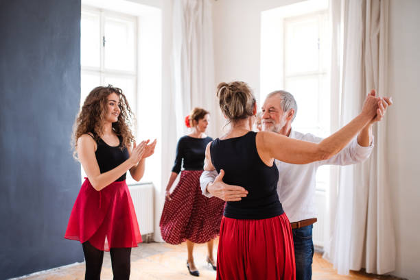 istock Group of senior people in dancing class with dance teacher. 1179563541