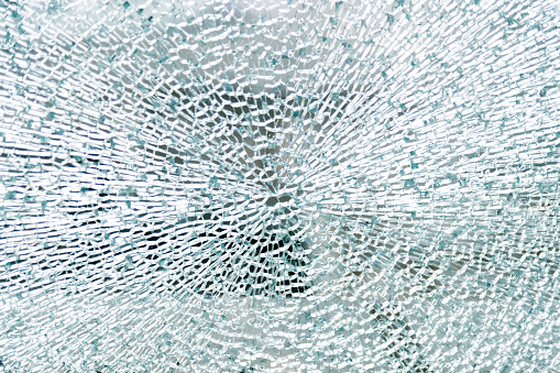 Close up of broken glass texture background.