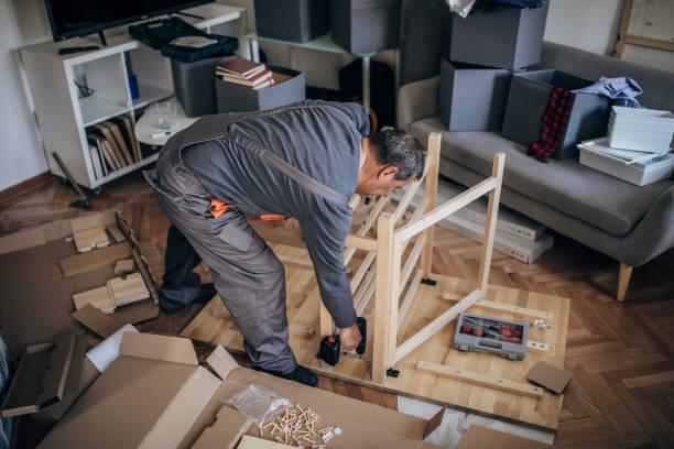 istock Senior man assembling furniture at home 1179565581