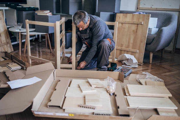 istock Mature man assembling furniture for new home 1179566789