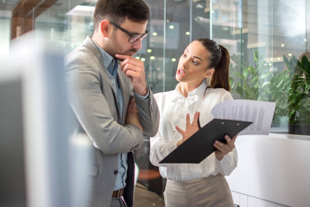 istock Business people discussing a document together 1179567020