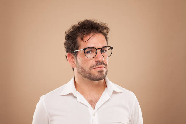 istock Brown boy with white shirt and glasses 1179567757