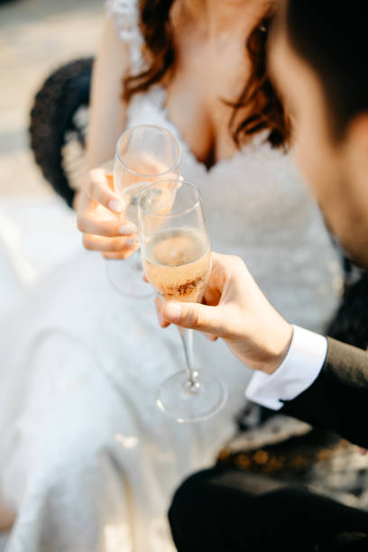 istock Bride And Groom Toasting Champagne Flutes 1179569955