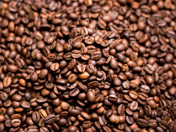 istock Coffee Background. roasted coffee beans, top view, Represent breakfast, energy, freshness or great aroma 1179570039