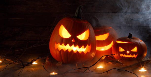 istock Halloween pumpkins and candles 1179571427