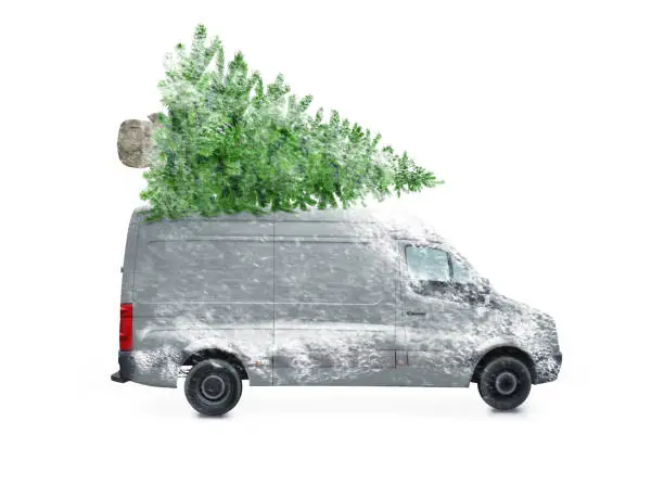 Photo of Driving delivery car with a christmas tree on the roof  isolated on white background. Transport and cargo concept.