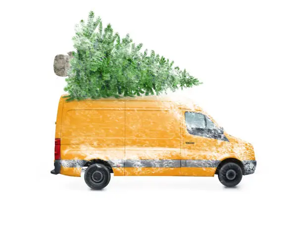Photo of Driving delivery car with a christmas tree on the roof  isolated on white background. Transport and cargo concept.