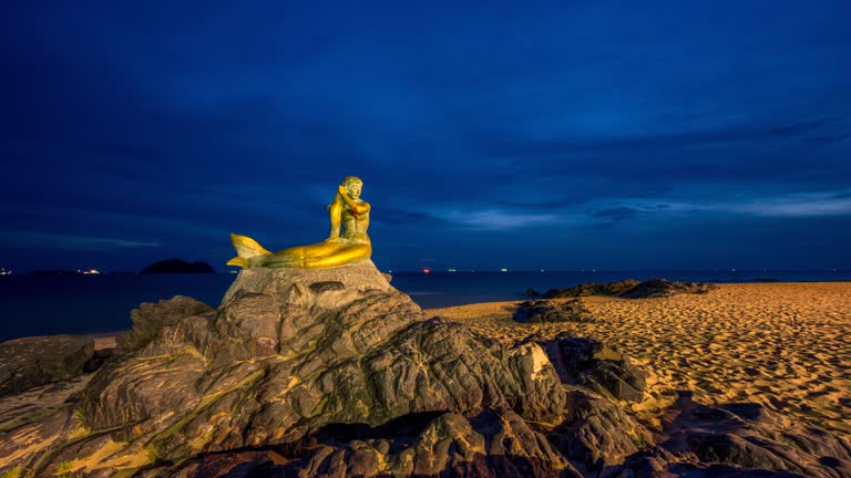 Time lapse Sunrise Scene of Mermaid Statue, Famous Travel Place in Songkhla, Thailand