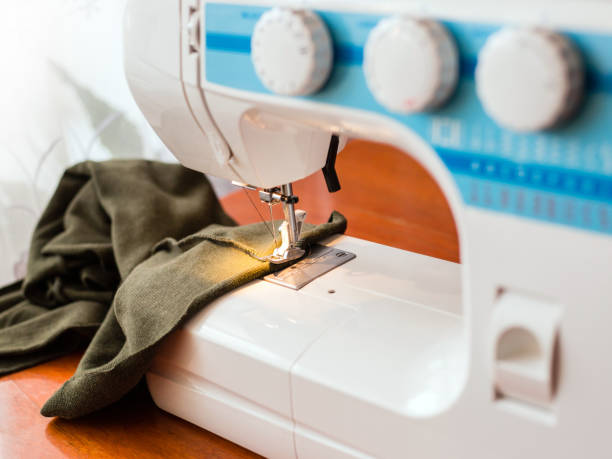 istock A sewing machine with fabric, atelier concept 1179571767