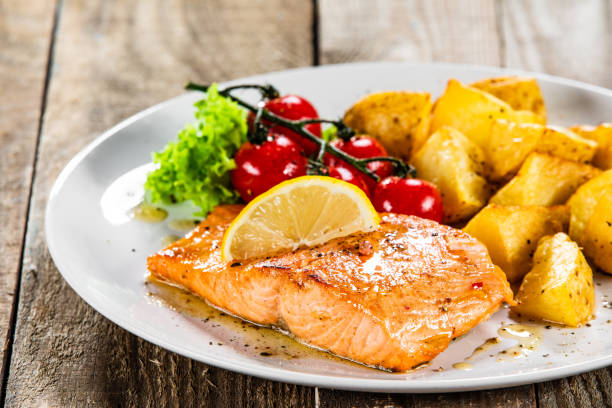 istock Roasted salmon and vegetables 1179571890