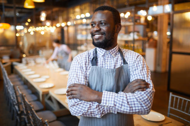 istock African-American Waiter in Restaurant 1179571998