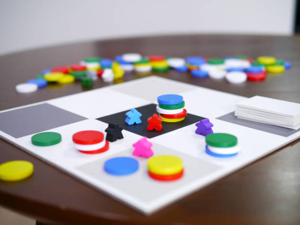 leisure playing fun board game on wooden table top selected focus