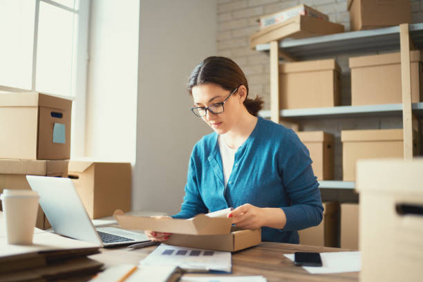 istock Woman is working at warehouse for online store. 1179574917
