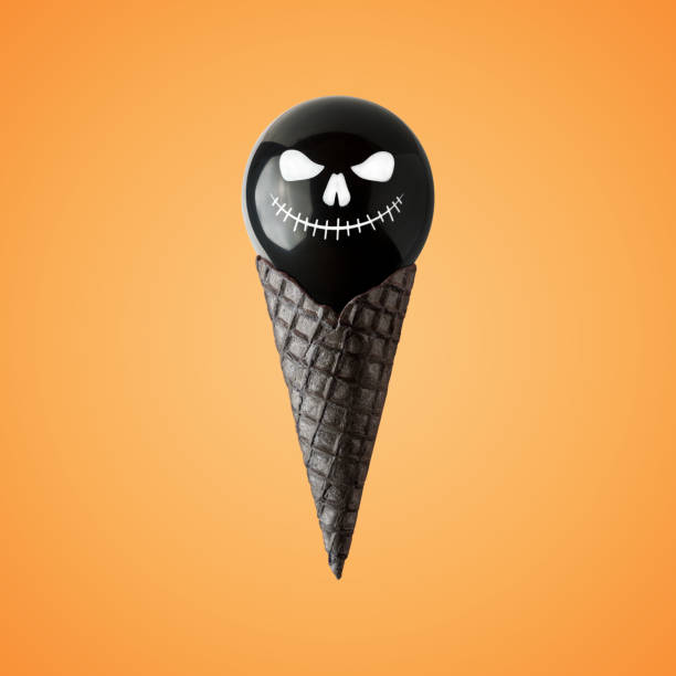 Halloween balloon with ice cream cone on bright background. Minimal holiday concept.