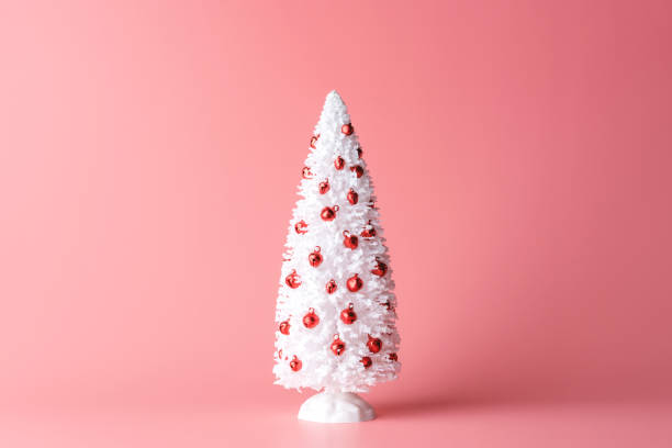 istock Minimal composition of white Christmas tree on pastel pink background. New Year concept. 1179575410