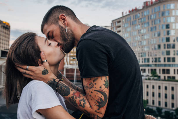 若いカップルのキス - passion people love sensuality ストックフォトと画像