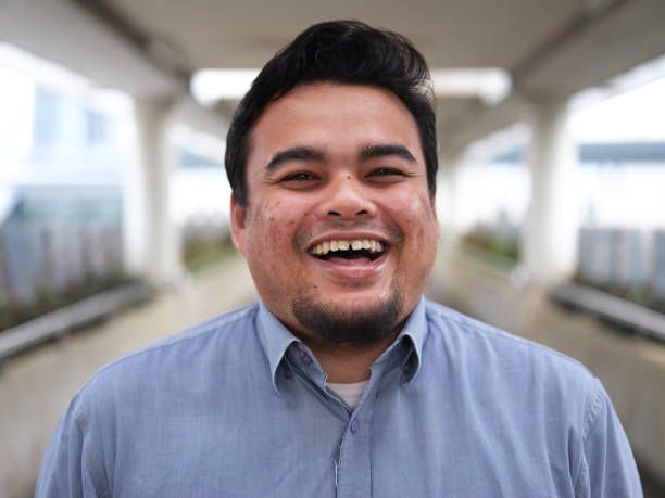 istock Portrait of smiling handsome young man 1179579106