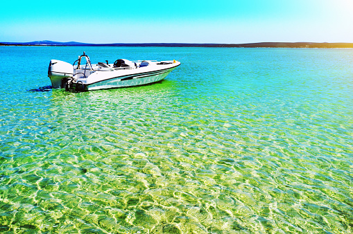 Motor boat in a lagoon of stunning natural beauty.