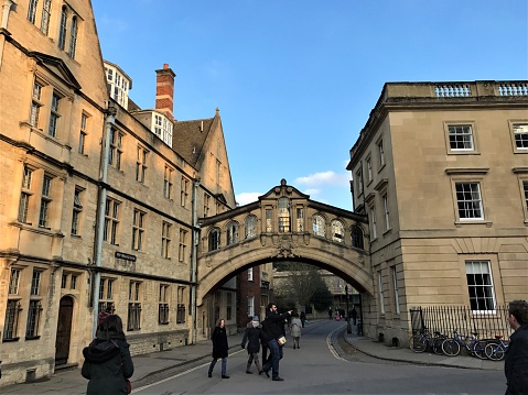 Oxford, England - February 18 2017: people visiting university buildings and street