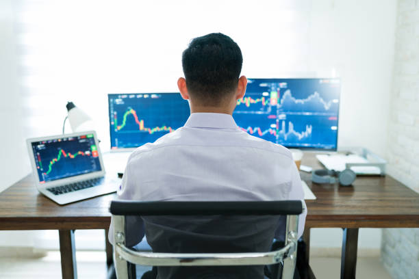 Freelance Online Trader Working At Desk