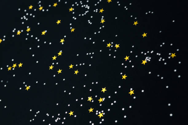 istock stars on a black paper background 1179581793
