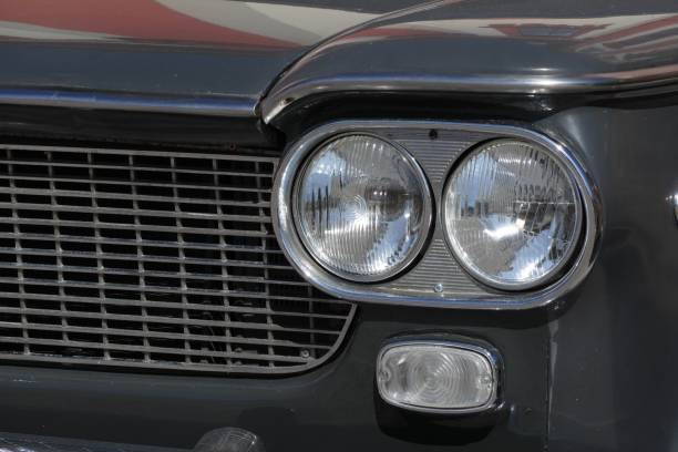 istock classic car headlamp and grill detail 1179581830