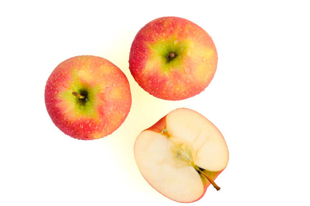 istock Sliced wet red apples isolated on white background ready to use in designs 1179581968