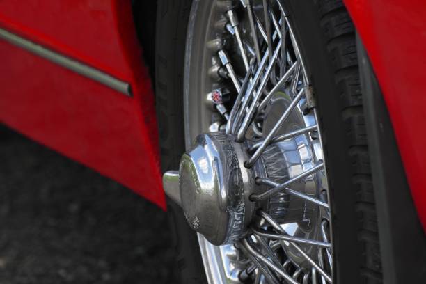 istock classic car chrome wired wheel detail 1179582011