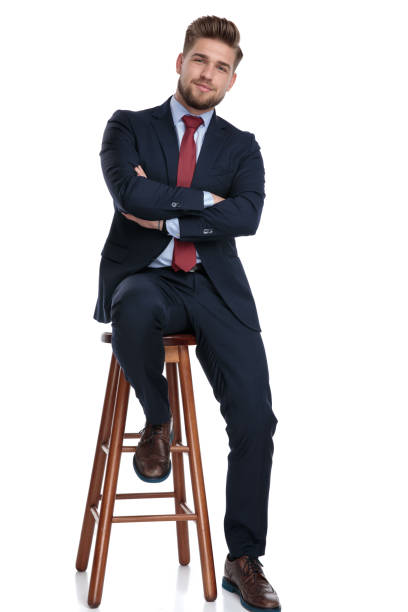 istock confident young businessman folding arms on white background 1179582663