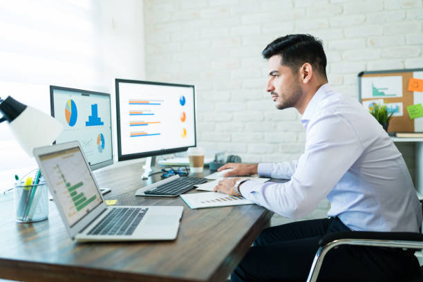 istock Freelance Salesman Examining Data At Desk 1179583418