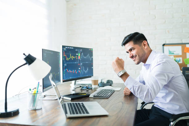 istock Attractive Freelance Stock Trader Celebrating Profit Share 1179583668