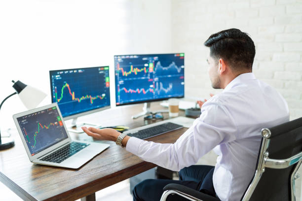 istock Worried Young Male Trader Working At Home 1179583715