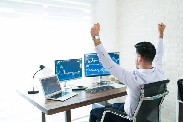 istock Excited Latin Finance Professional Sitting Computer Desk 1179583737