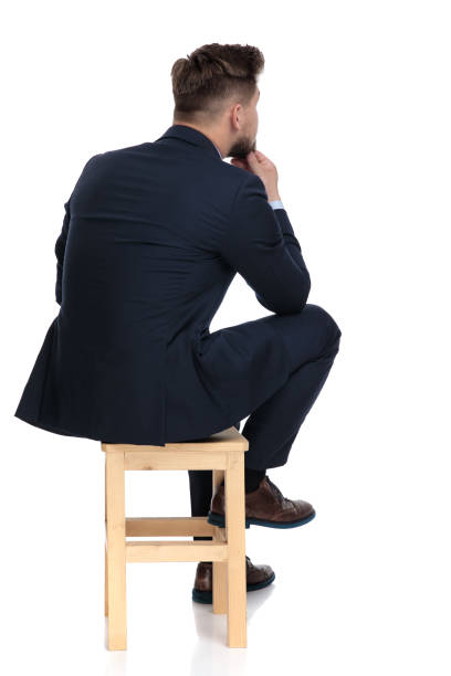 istock back view of young businessman thinking in studio 1179583791